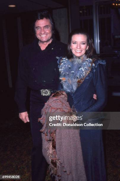 Husband and wife musicians Johnny Cash and June Carter Cash attends an event in May 1980 in Los Angeles, California.