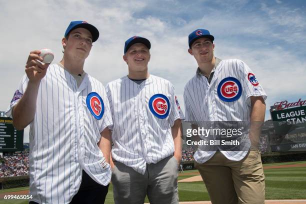 Nolan Patrick, Casey Mittelstadt and Gabriel Vilardi pose for photographers before a game between the Chicago Cubs and the San Diego Padres during...