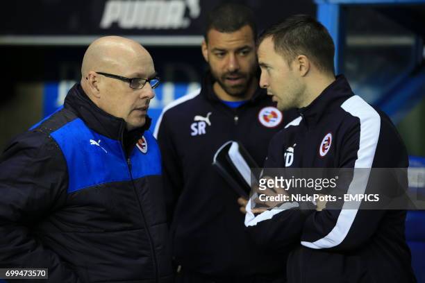 Reading manager Brian McDermott speaks with his backroom staff