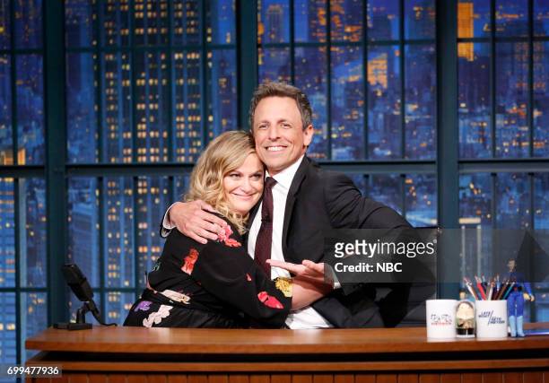 Episode 546 -- Pictured: Actress.comedian Amy Poehler with host Seth Meyers during a segment on June 21, 2017 --