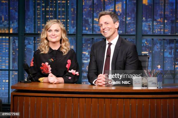 Episode 546 -- Pictured: Actress.comedian Amy Poehler with host Seth Meyers during a segment on June 21, 2017 --