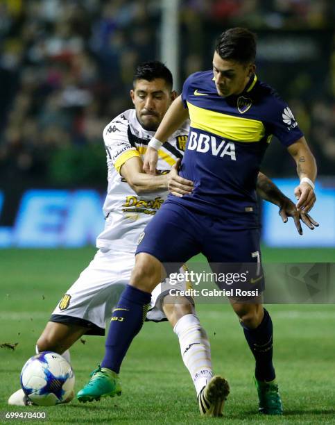 Cristian Pavon of Boca Juniors fights for the ball with Jonathan Blanco of Olimpo during a match between Olimpo and Boca Juniors as part of Torneo...