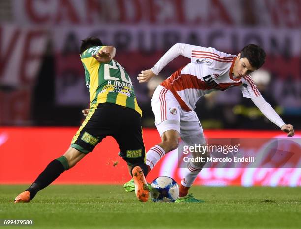 Ignacio Fernandez of River Plate fights for ball with Antonio Medina of Aldosivi during a match between River Plate and Aldosivi as part of Torneo...