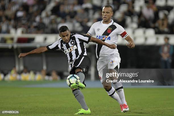 Arnaldo of Botafogo battles for the ball with Luis Fabiano of Vasco during the match between Botafogo and Vasco as part of Brasileirao Series A 2017...