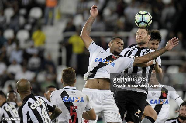 Joel Carliof Botafogo battles for the ball with Breno of Vasco during the match between Botafogo and Vasco as part of Brasileirao Series A 2017 at...