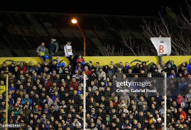 Fans of Boca Juniors cheer for their team during a match between Olimpo and Boca Juniors as part of Torneo Primera Division 2016/17 at Roberto...