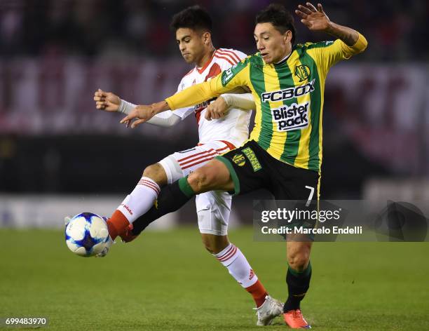 Gonzalo Martinez of River Plate fights for ball with Pablo Luguercio of Aldosivi during a match between River Plate and Aldosivi as part of Torneo...