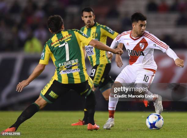 Gonzalo Martinez of River Plate fights for ball with Pablo Luguercio of Aldosivi during a match between River Plate and Aldosivi as part of Torneo...