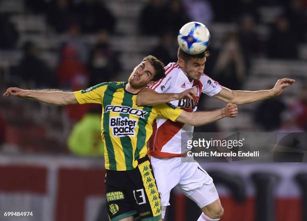 Lucas Alario of River Plate goes for a header with Ramiro Arias of Aldosivi during a match between River Plate and Aldosivi as part of Torneo Primera...