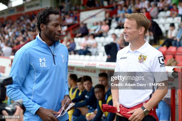 Stevenage manager Teddy Sheringham and Tottenham Hotspur XI Under 21 manager Ugo Ehiogu chat before the match