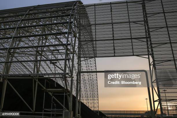 Pile of coal sits at the Sahiwal coal power plant, owned by China's state-owned Huaneng Shandong Rui Group, at sunset in Sahiwal, Punjab, Pakistan,...