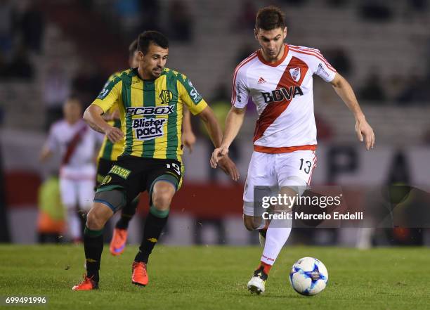 Lucas Alario of River Plate fights for ball with Luis Sosa Otermin of Aldosivi during a match between River Plate and Aldosivi as part of Torneo...