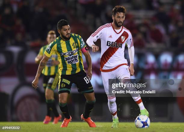 Marcelo Larrondo of River Plate fights for ball with Alan Alegre of Aldosivi during a match between River Plate and Aldosivi as part of Torneo...