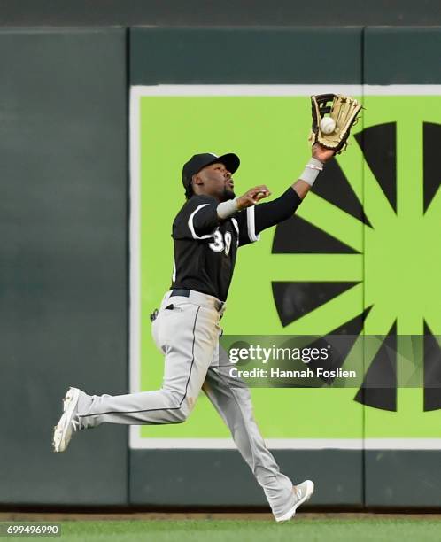 Alen Hanson of the Chicago White Sox makes a catching right field of the ball hit by Eduardo Escobar of the Minnesota Twins during the fourth inning...