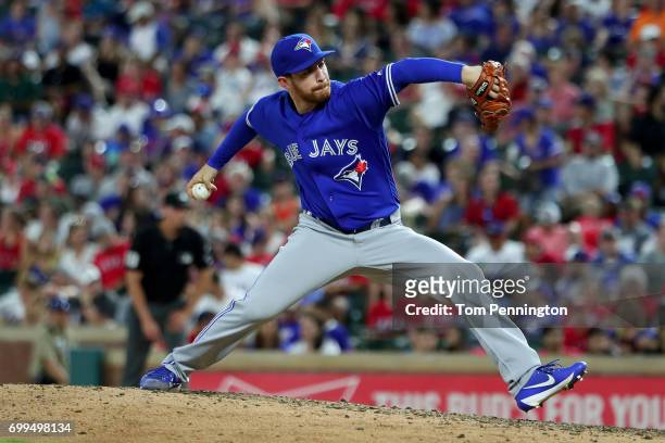 Danny Barnes of the Toronto Blue Jays pitches against the Texas Rangers in the bottom of the seventh inning at Globe Life Park in Arlington on June...