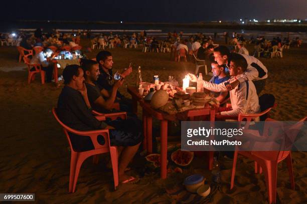 People during Iftar, a meal after the sunset, consumed on Rabat beach, in Rabat, Morocco on June 21, 2017. Laylat al-Qadr, or Night of Destiny, which...