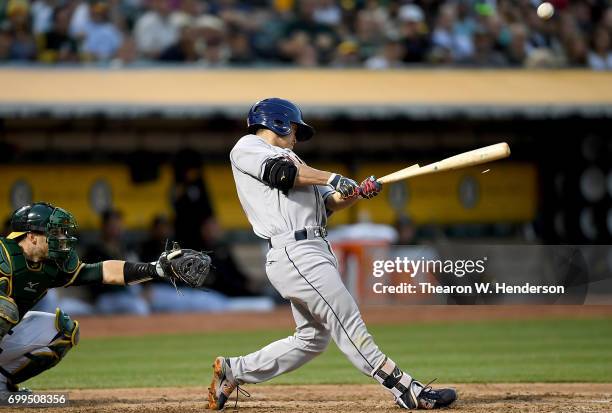 Norichika Aoki of the Houston Astros breaks his bat while popping out to third baseman Ryon Healy of the Oakland Athletics in the top of the fifth...