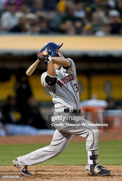 Norichika Aoki of the Houston Astros breaks his bat while popping out to third baseman Ryon Healy of the Oakland Athletics in the top of the fifth...