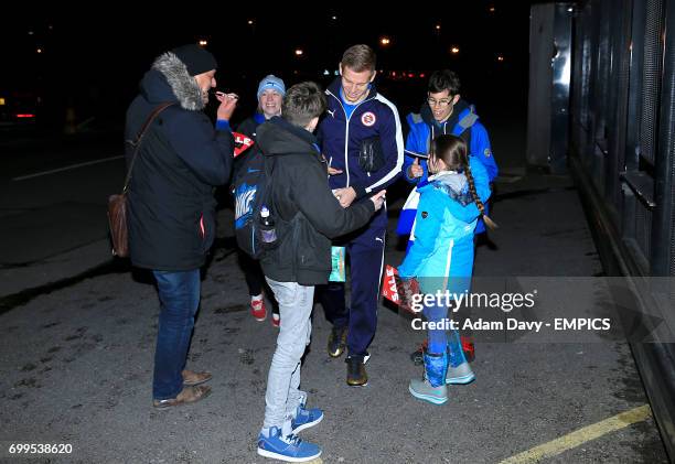 Reading's Matej Vydra signs autographs for supporters before the game