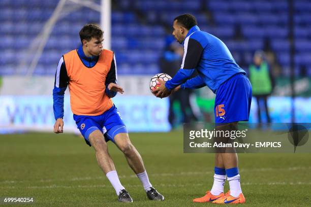 Reading's Jake Cooper and Reading's Anton Ferdinand warm up before the game