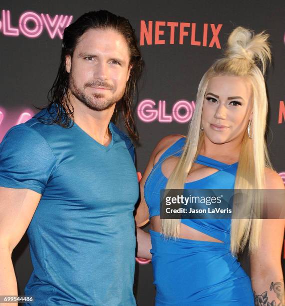 Wrestlers John Morrison and Taya Valkyrie attend the premiere of "GLOW" at The Cinerama Dome on June 21, 2017 in Los Angeles, California.