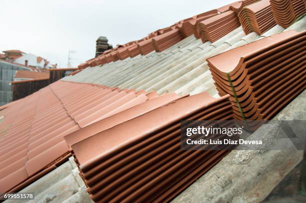 replacement of a roof due to deterioration - roof replacement stock pictures, royalty-free photos & images
