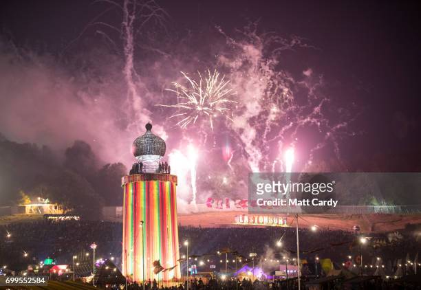 Fireworks illuminate the night sky at the end of the first day at the Glastonbury Festival at Worthy Farm in Pilton on June 21, 2017 near...