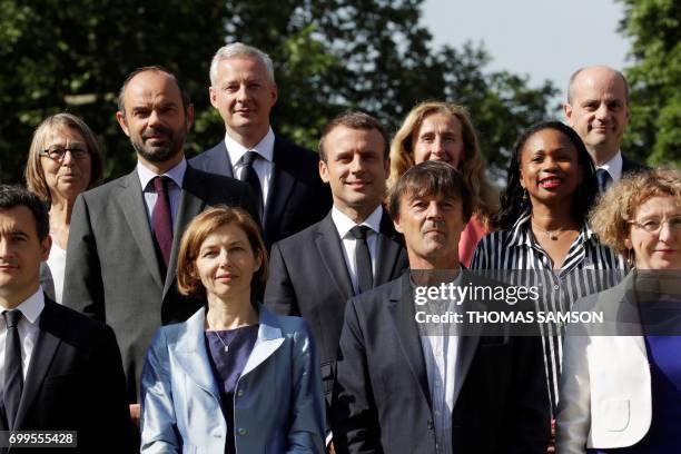 French president Emmanuel Macron poses with the members of the governement Minister of Culture Francoise Nyssen, Minister of Economy Bruno Le Maire,...