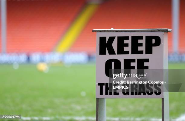 View of a Keep Off the Grass sign at Bloomfield Road