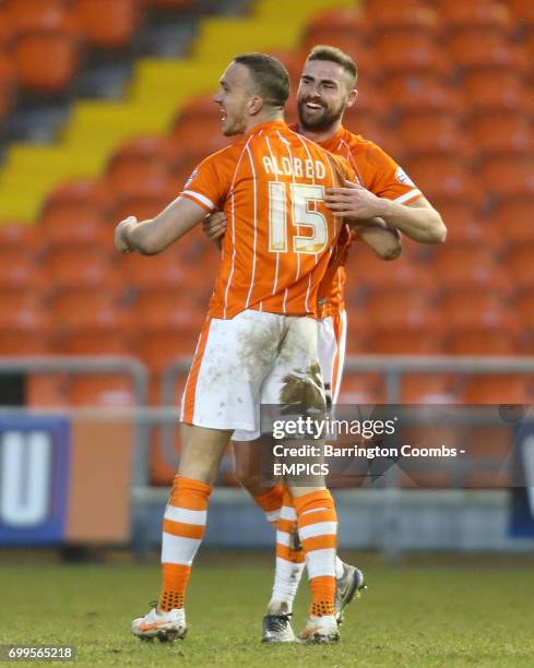 Blackpool's Tom Aldred and Clark Robertson celebrate after the final whistle.