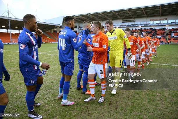 Blackpool and Gillingham players shake hands prior to kick-off.