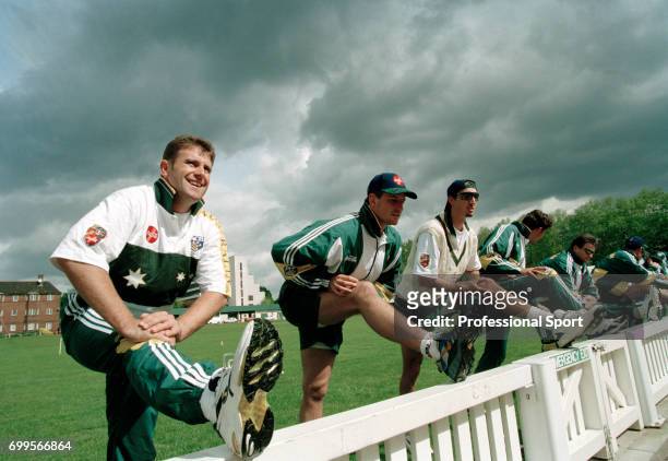 Australia captain Mark Taylor and members of the Australia Cricket Team stretching during a practice session on the Nursery Ground of Lord's Cricket...