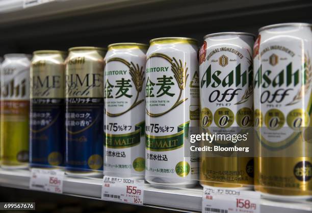Cans of low-malt beer are displayed for sale at the Bic Camera Akiba electronics store, operated by Bic Camera Inc., in the Akihabara district of...