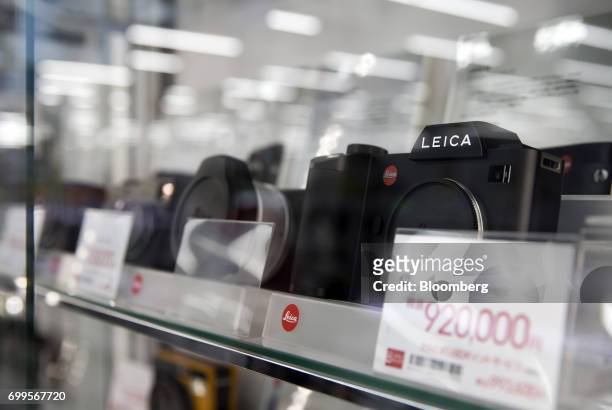 Leica Camera AG digital cameras are displayed for sale at the Bic Camera Akiba electronics store, operated by Bic Camera Inc., in the Akihabara...
