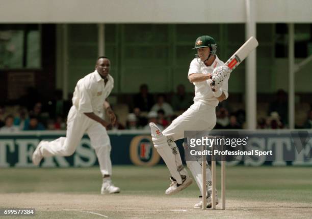 Australia batsman Greg Blewett pulls a delivery from England bowler Devon Malcolm during his innings of 125 in the 2nd innings of the 1st Test match...