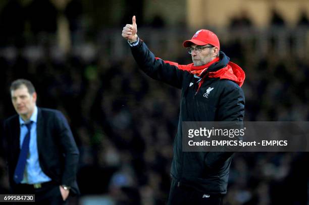 Liverpool manager Jurgen Klopp alongside West Ham United manager Slaven Bilic on the touchline during the Emirates FA Cup, fourth round replay match...