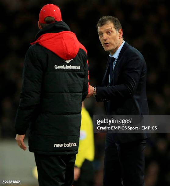 West Ham United manager Slaven Bilic and Liverpool manager Jurgen Klopp during the Emirates FA Cup, fourth round replay match at Upton Park, London.