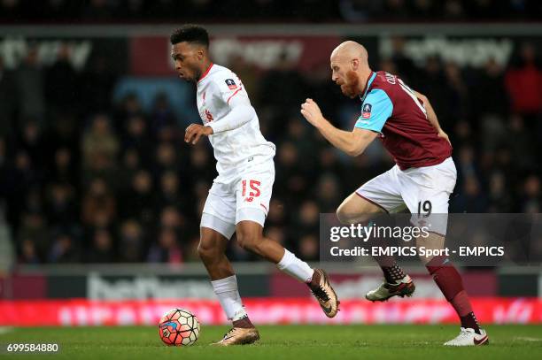 Liverpool's Daniel Sturridge and West Ham United's James Collins in action during the Emirates FA Cup, fourth round replay match at Upton Park,...