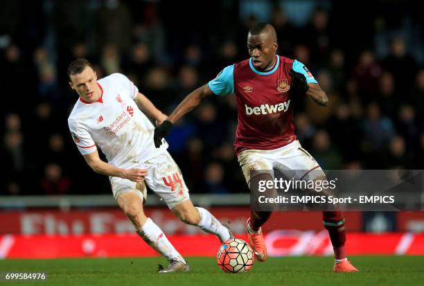 West Ham United's Enner Valencia and Liverpool's Brad Smith in action during the Emirates FA Cup, fourth round replay match at Upton Park, London.