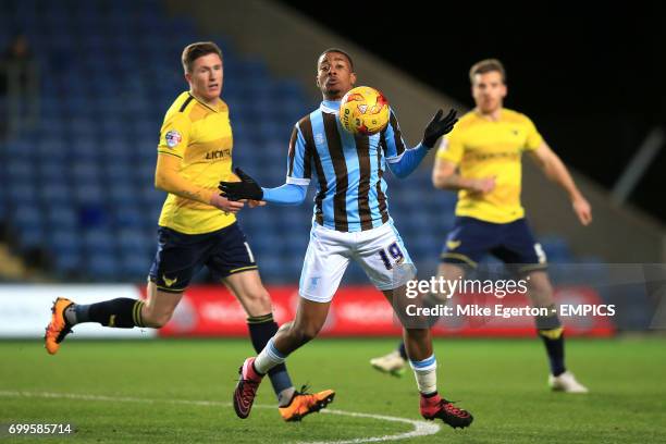 Mansfield Town's Reggie Lambe shields the ball from Oxford United's John Lundstram