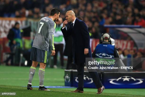 Real Madrid's Cristiano Ronaldo and coach Zinedine Zidane have a word during the match