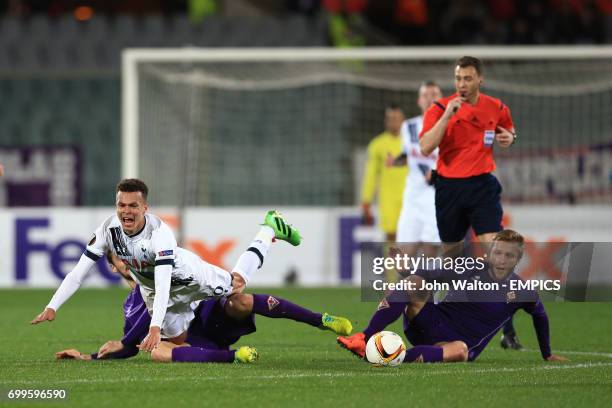 Tottenham Hotspur's Dele Alli ) is tripped by Fiorentina's Matias Fernandez's challenge