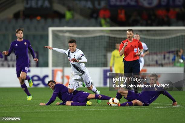 Fiorentina's Davide Astori Tottenham Hotspur's Dele Alli and Fiorentina's Matias Fernandez battle for the ball