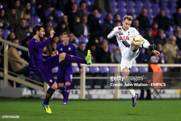 Fiorentina's Davide Astori and Tottenham Hotspur's Christian Eriksen battle for the ball