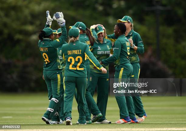 Nadine de Klerk of South Africa celebrates her second run-out with team mates during the ICC Women's World Cup warm up match between West Indies and...