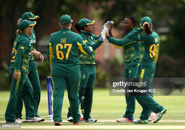 Masabata Klaas of South Africa celebrates a wicket with team mates during the ICC Women's World Cup warm up match between West Indies and South...