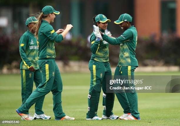 Masabata Klaas of South Africa celebrates a run out with team mates during the ICC Women's World Cup warm up match between West Indies and South...