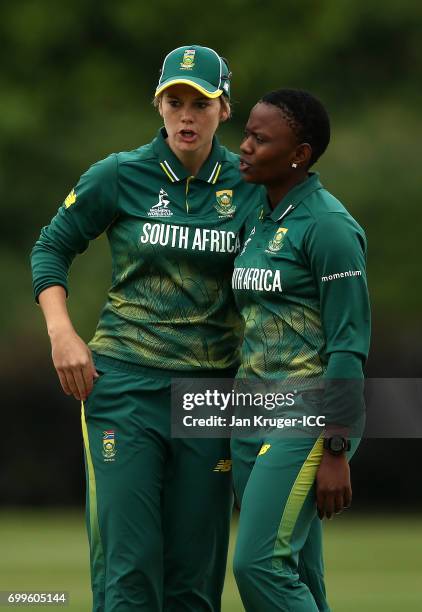 Masabata Klaas of South Africa chats with captain Dane van Niekerk during the ICC Women's World Cup warm up match between West Indies and South...