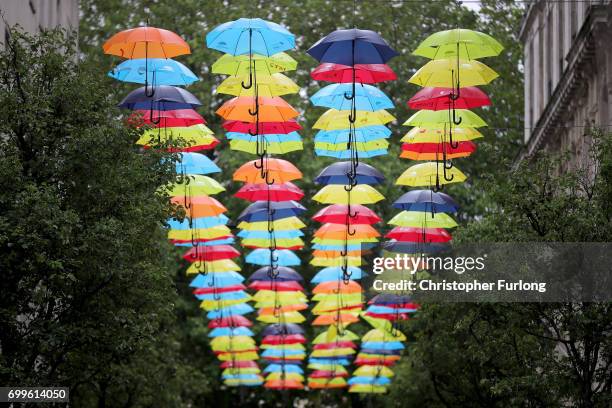 An art installation called the Umbrella Project, featuring 200 brightly coloured umbrellas hangs over Church Alley on June 22, 2017 in Liverpool,...