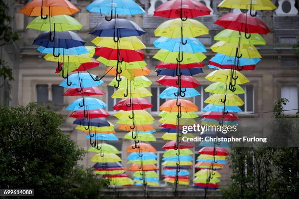 An art installation called the Umbrella Project, featuring 200 brightly coloured umbrellas hangs over Church Alley on June 22, 2017 in Liverpool,...